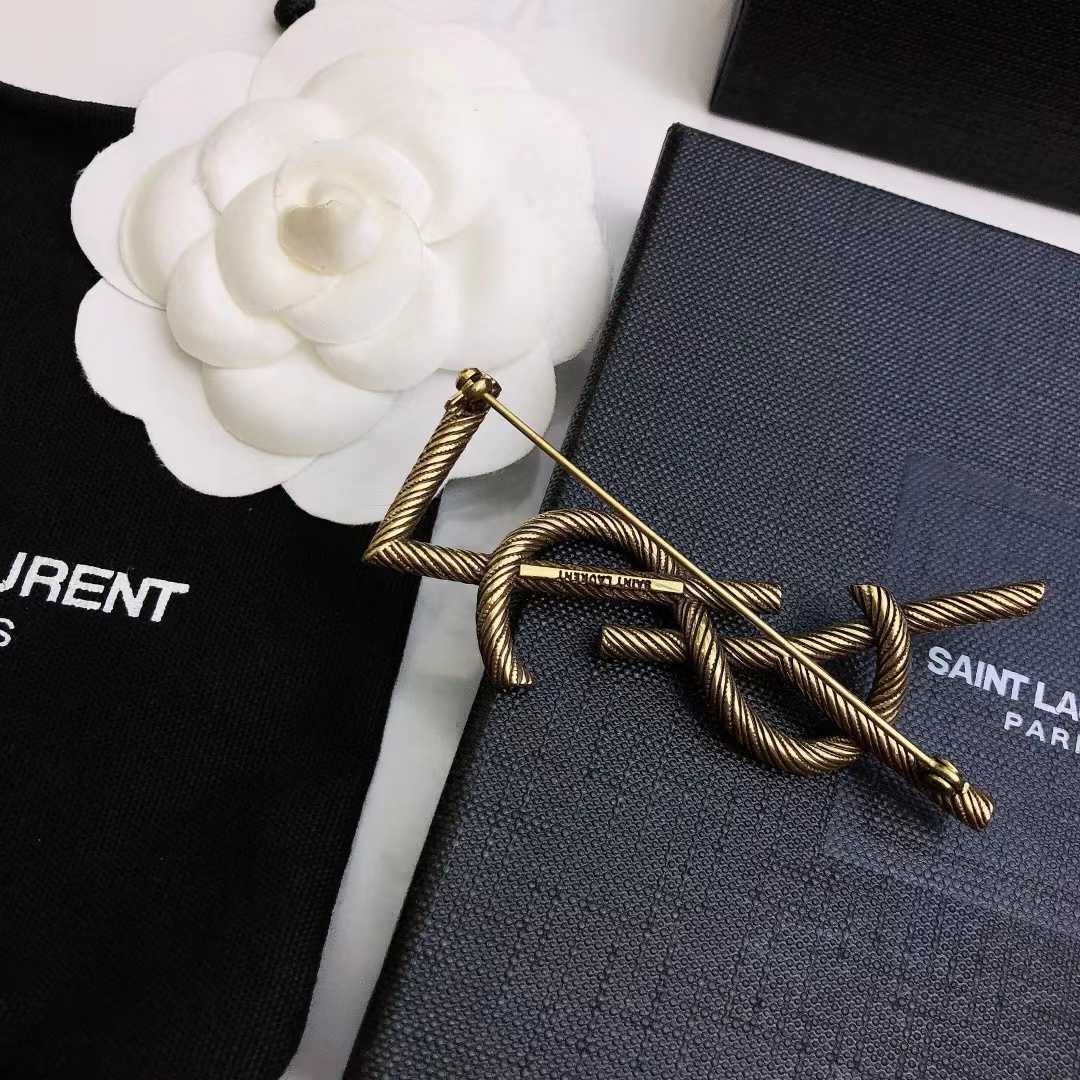 Saint Laurent Goldtone YSL Logo Brooch - DesignerGu