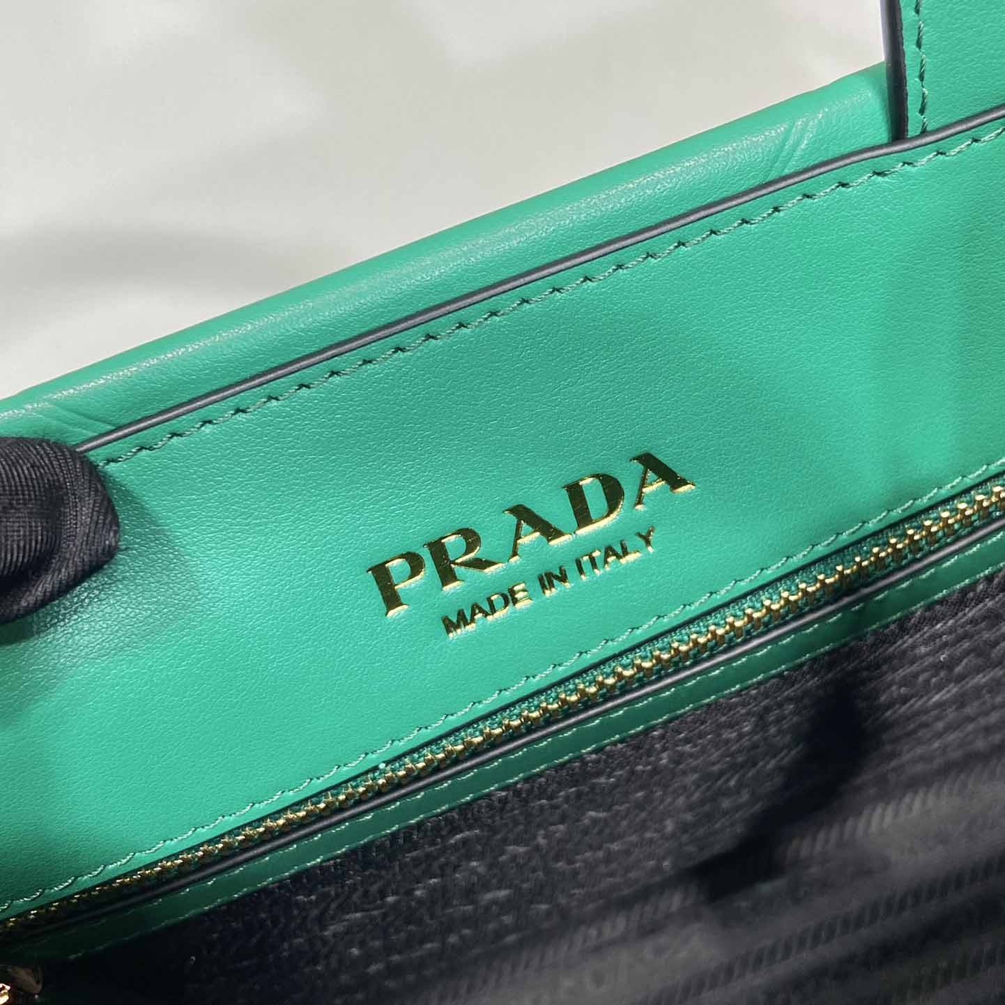 Prada Small Leather Prada Symbole Bag With Topstitching - DesignerGu