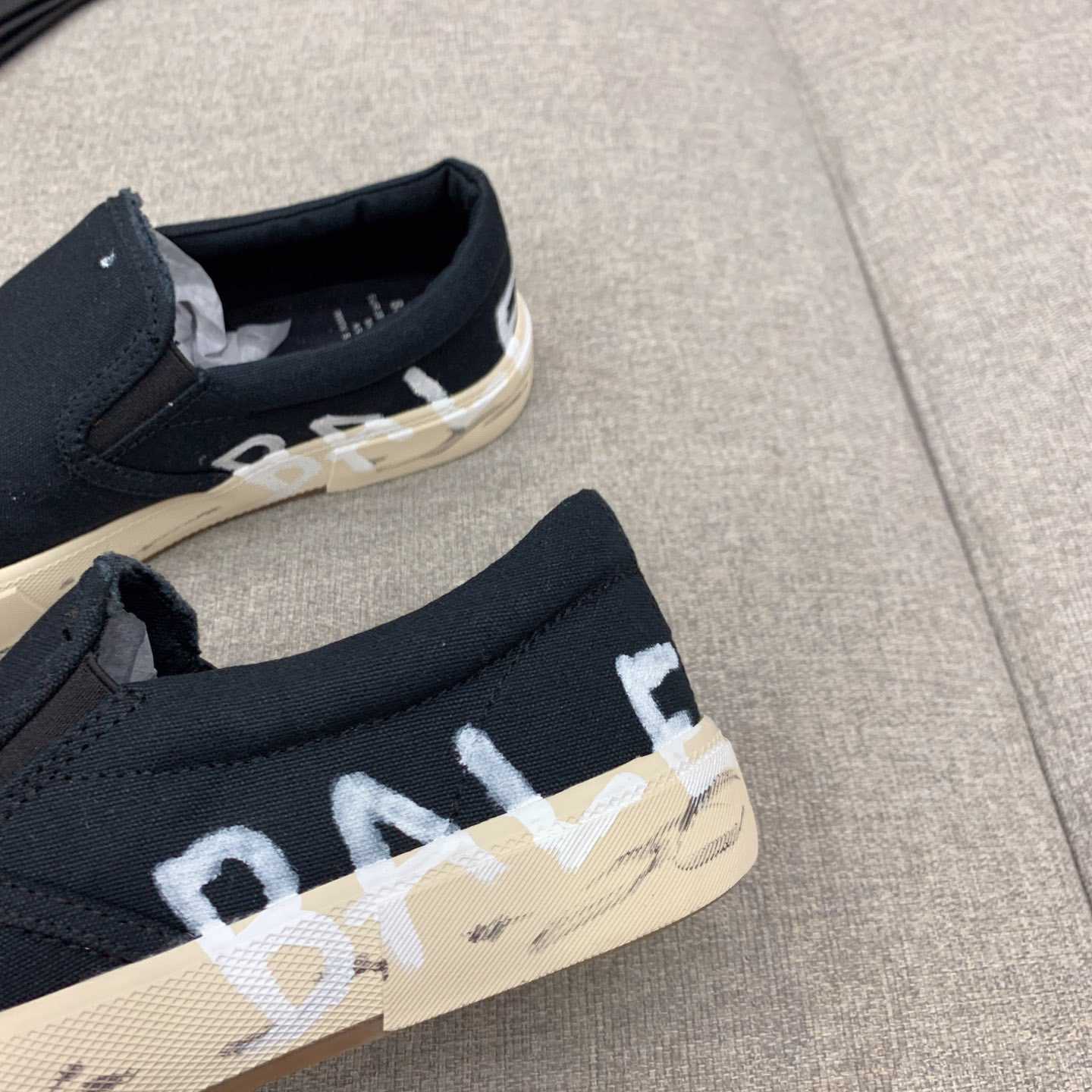 Balenciaga Paris Slip On Graffiti Sneaker In Black - DesignerGu