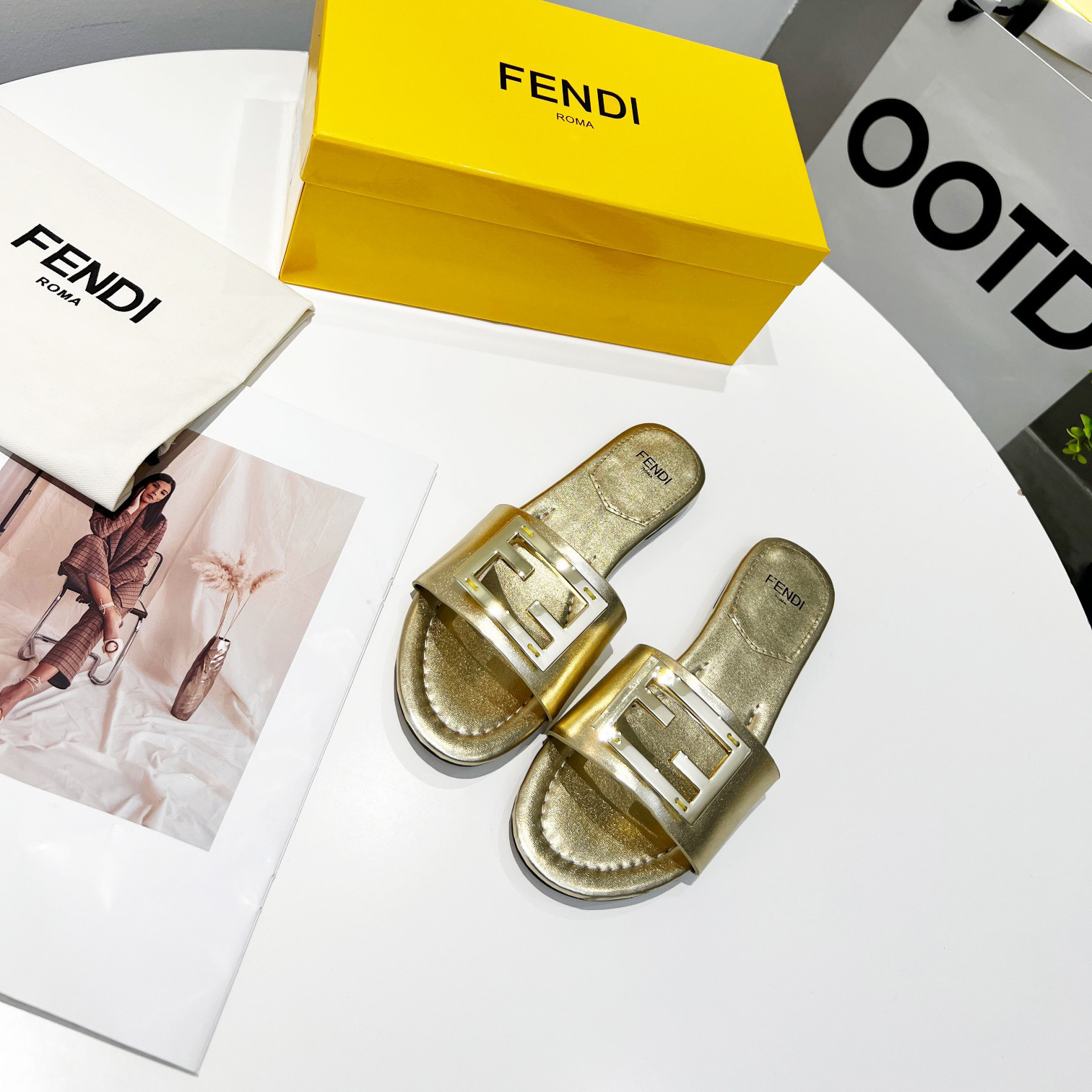 Fendi Baguette Gold nappa leather slides - DesignerGu