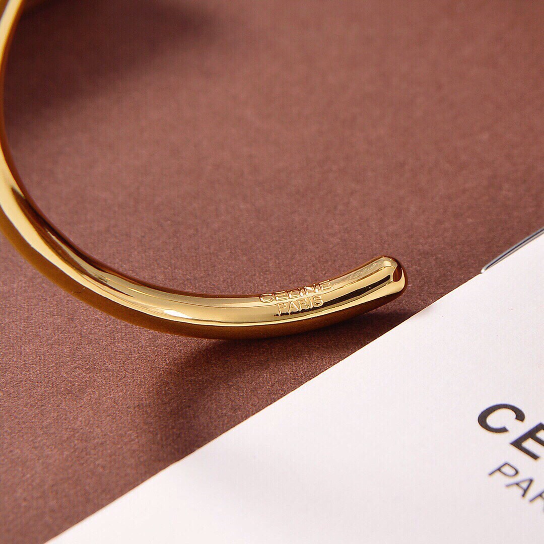 Celine Maillon Triomphe Thin Cuff In Brass With Gold Finish - DesignerGu