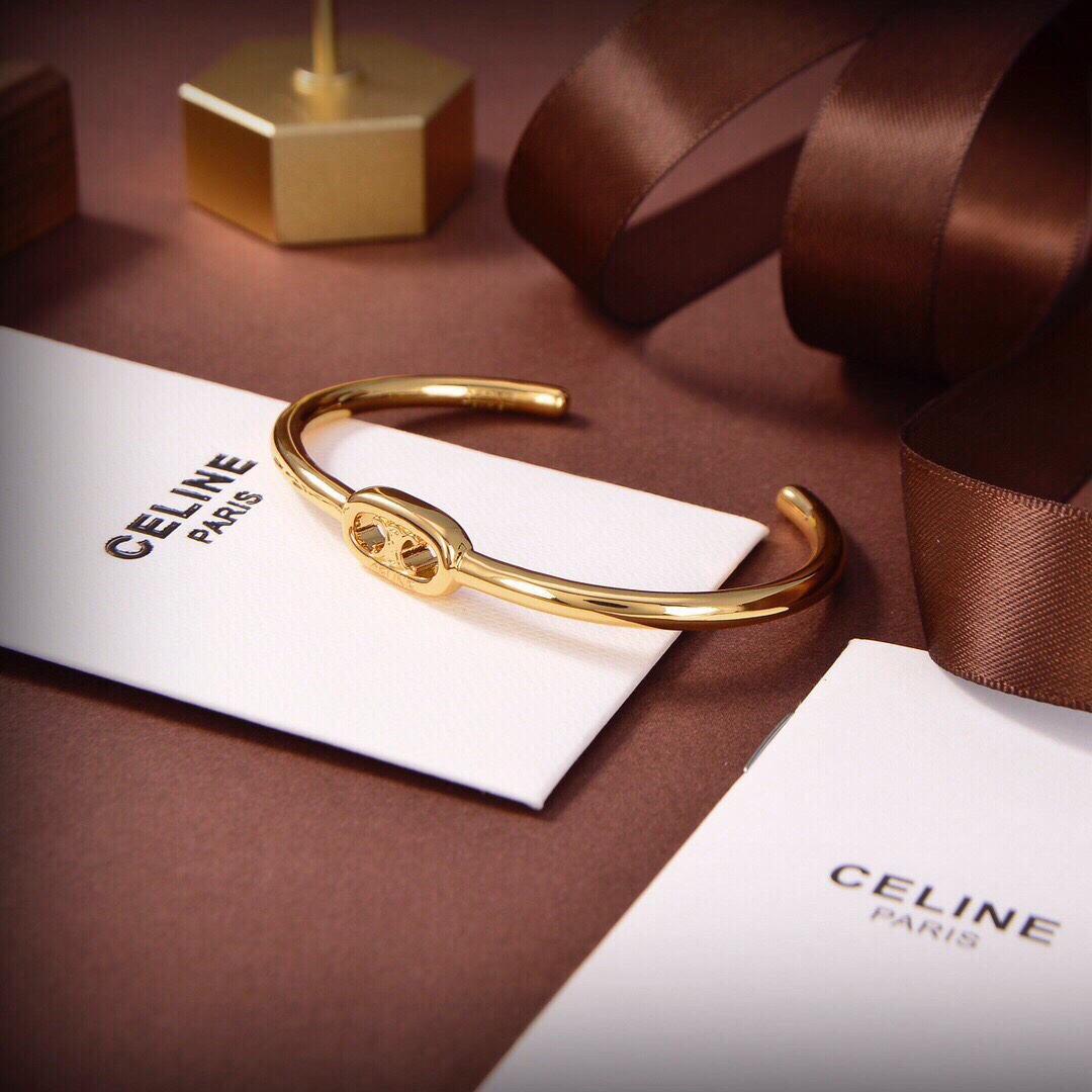 Celine Maillon Triomphe Thin Cuff In Brass With Gold Finish - DesignerGu