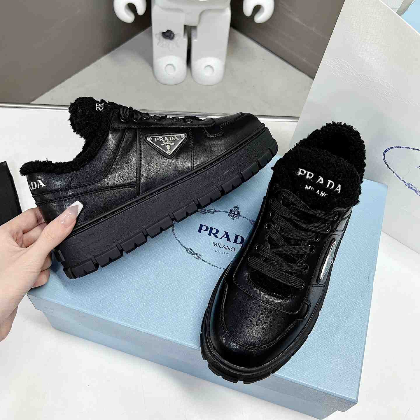 Prada Leather And Shearling Sneakers - DesignerGu