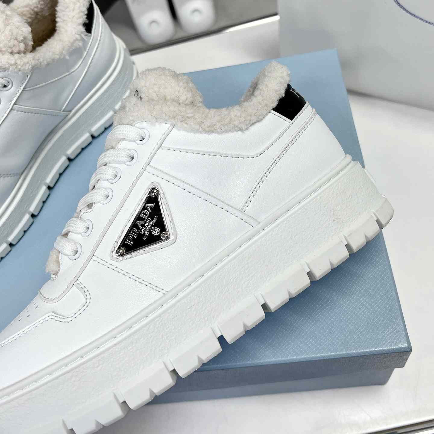 Prada Leather And Shearling Sneakers - DesignerGu