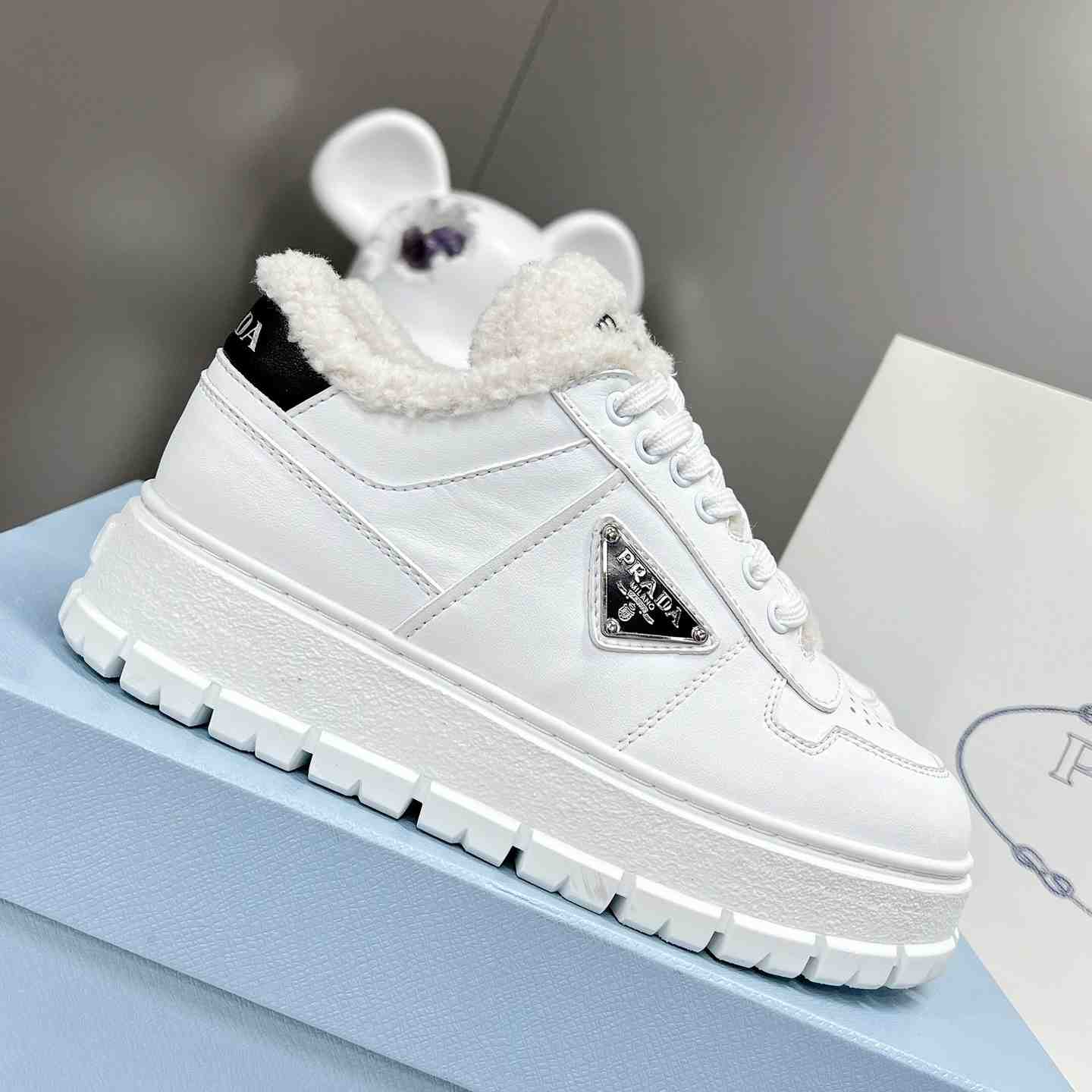 Prada Leather And Shearling Sneakers - DesignerGu