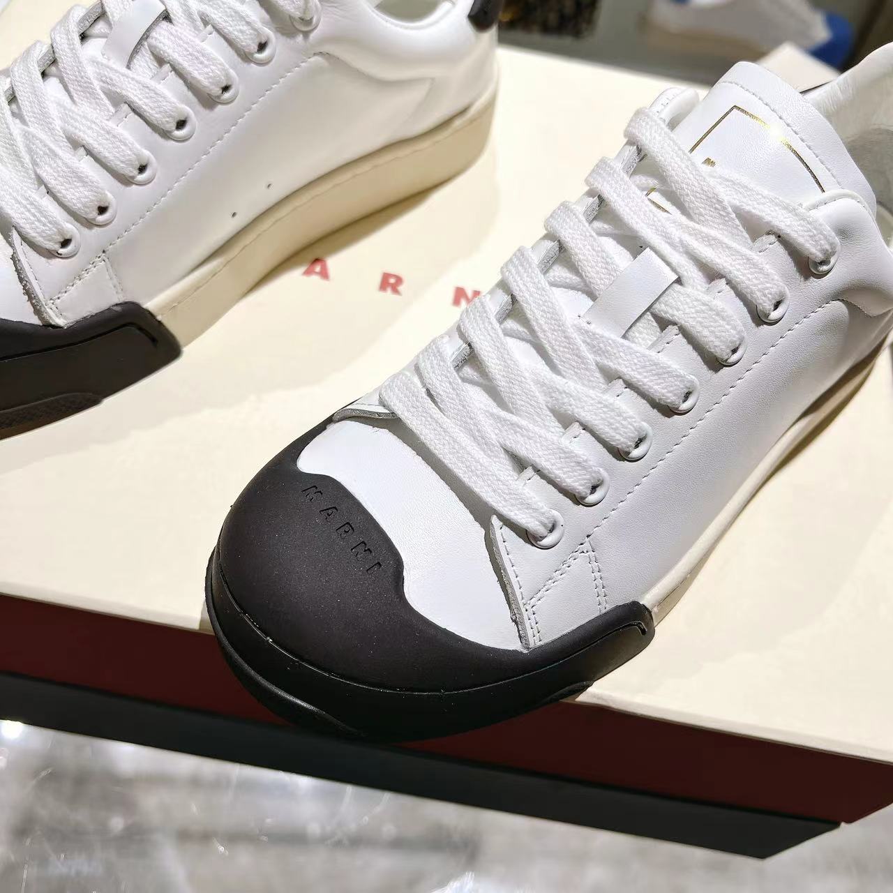 Marni Dada Bumper Sneaker In White And Black Leather - DesignerGu