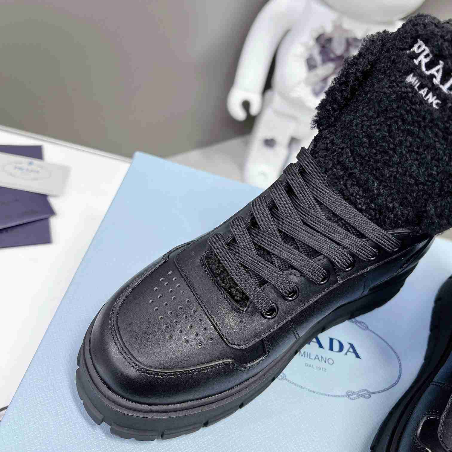 Prada Leather And Shearling High-top Sneakers - DesignerGu