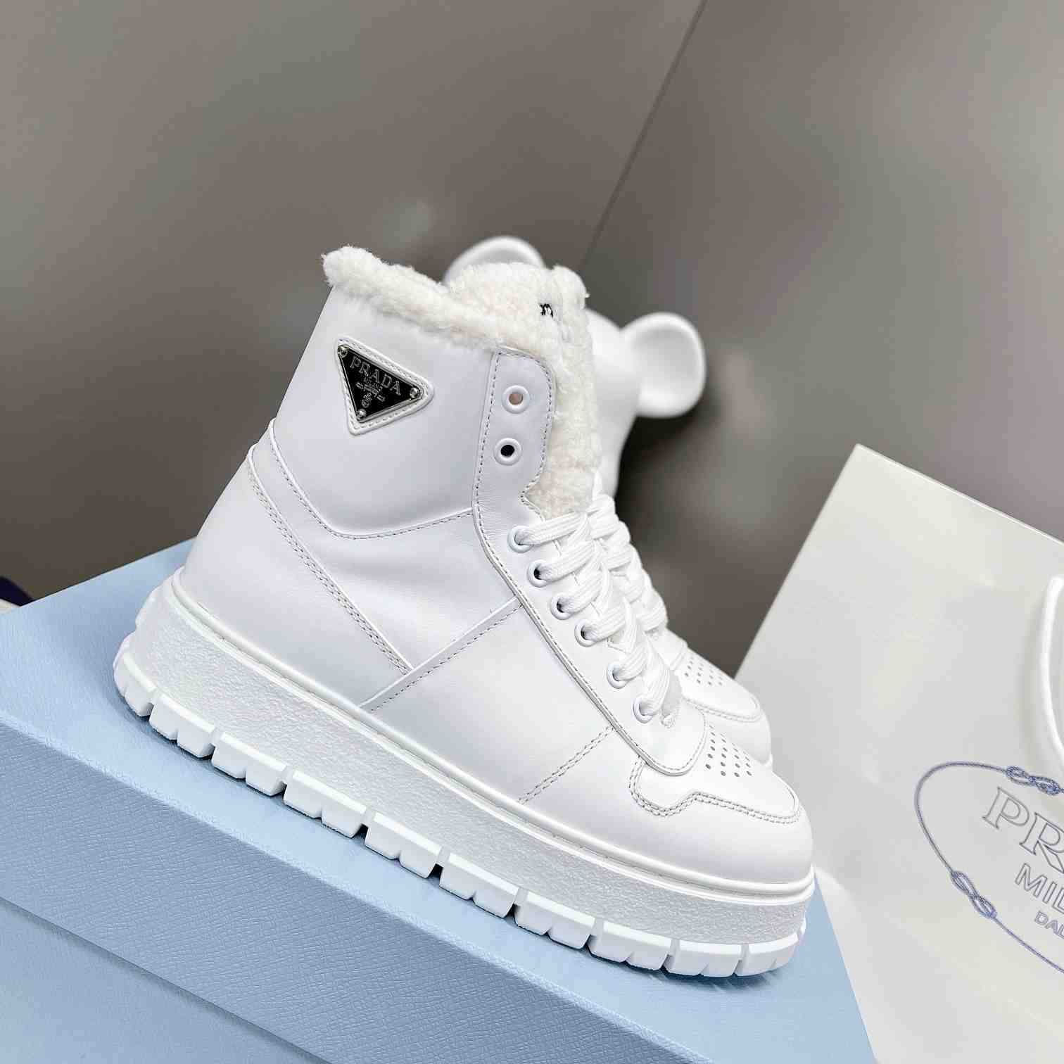 Prada Leather And Shearling High-top Sneakers - DesignerGu