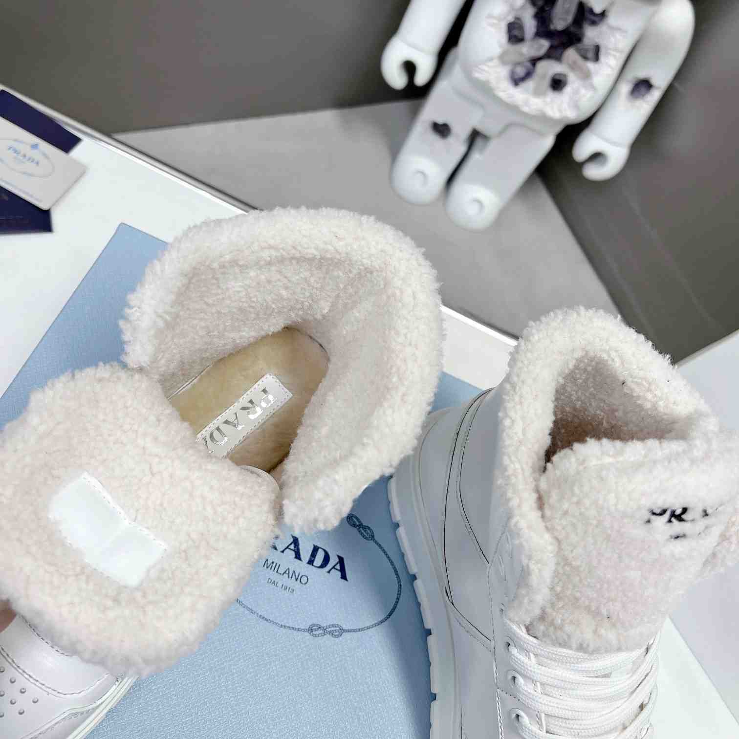 Prada Leather And Shearling High-top Sneakers - DesignerGu